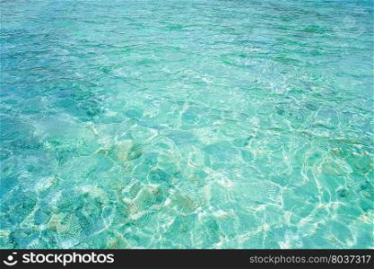 Crystal clear blue water in tropical lagoon for texture or background. Crystal clear blue water in tropical lagoon