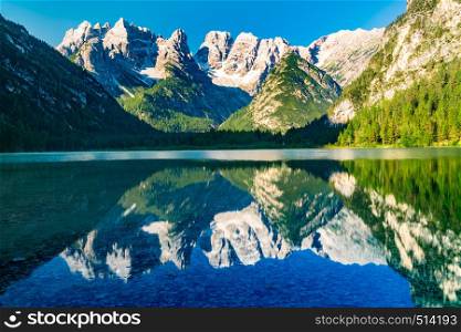 Crystal clear water at Lake Durrensee and the famous Dolomites Mountain in the morning at South Tyrol, Italy