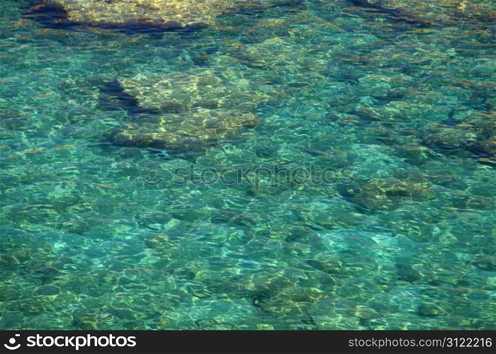 Crystal clear waters at Anthony Quinn Bay in Greece