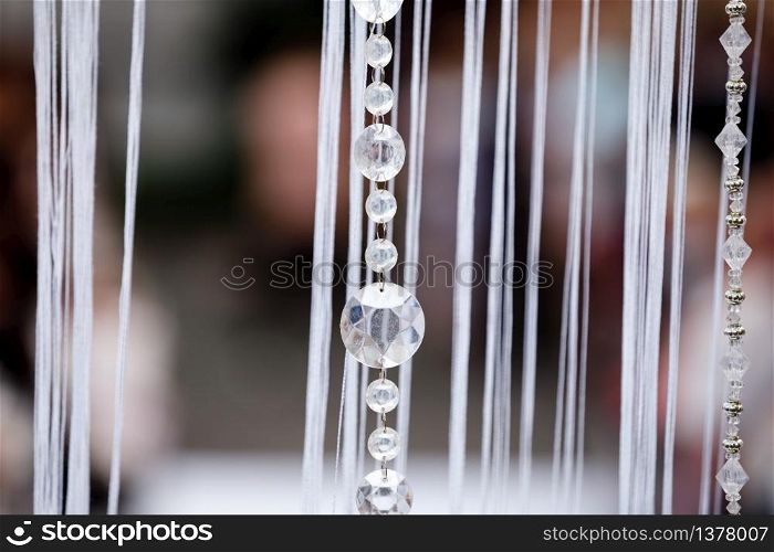 Crystal decorations for the wedding ceremony, luxurious decor. Beautiful arch decorated with chains with transparent beads.. Crystal decorations for the wedding ceremony, luxurious decor. Beautiful arch decorated with chains with transparent beads