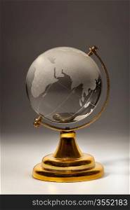 Crystal glass globe on gradient gray background