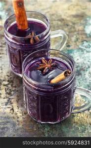 Crystal goblet with mulled wine and cinnamon stick in it,decorated with star anise
