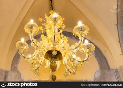 Crystal luxury chandelier in retro interior. Crystal luxury chandelier