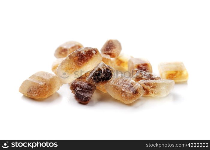 Crystals of Candi sugar / Rock sugar isolated on white with natural shadows.