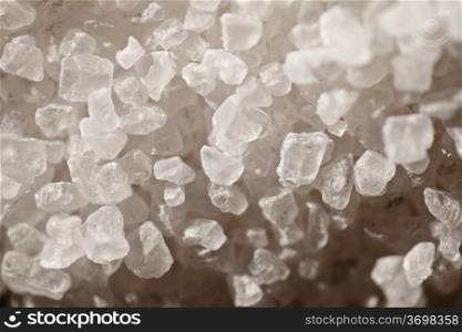Crystals of of table salt in close-up, side lighting