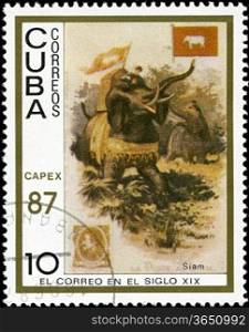 CUBA - CIRCA 1987: A stamp printed in the Cuba, shows traditional old vehicles. Siamese elephants, circa 1987