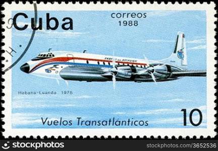 CUBA - CIRCA 1988: A Stamp printed in CUBA shows image of the airplane in transatlantic flight, Habana - Luanda in 1975, circa 1988