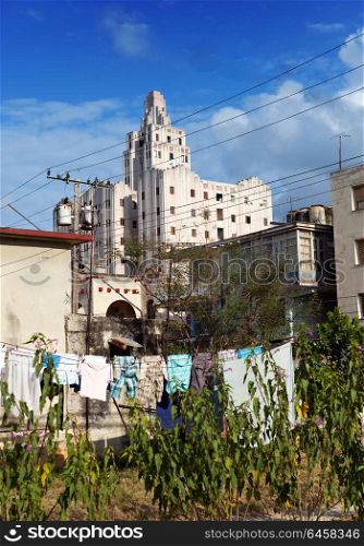 Cuba. Contrasts of old Havana - high-rise buildings and linen drying in the forefront in a yard