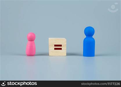 cube block of equal sign between Pink Women and Blue Men wooden symbol. gender equality concept