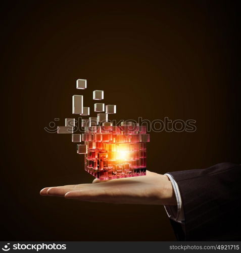 Cube in male hand. Businessman hand shows digital cube as thinking outside the box concept