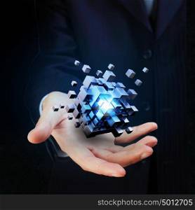 Cube in male hand. Businessman hand shows digital cube as thinking outside the box concept