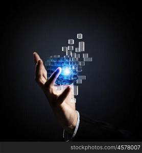 Cube in male hand. Businessman hand take digital cube as thinking outside the box concept