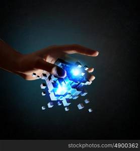 Cube in male hand. Businessman hand take digital cube as thinking outside the box concept
