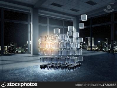 Cube in modern office. Night office interior with 3D cube figure. Mixed media