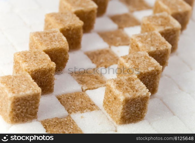 Cubes of not refined reed sugar and white sugar