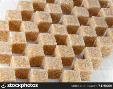 Cubes of not refined reed sugar and white sugar