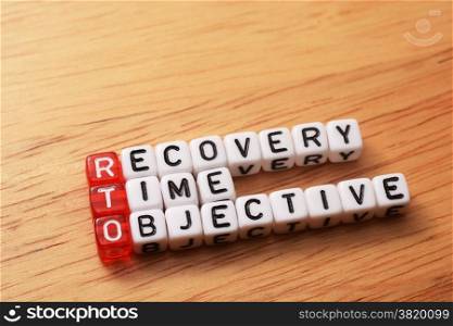 cubes with text , rto recovery time objective on wood