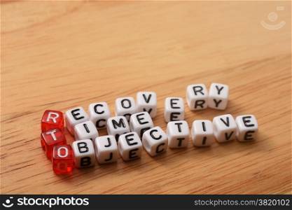 cubes with text , rto recovery time objective on wood