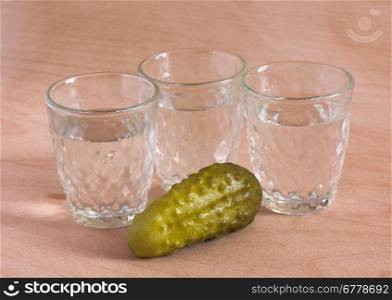 Cucumber and glasses of vodka