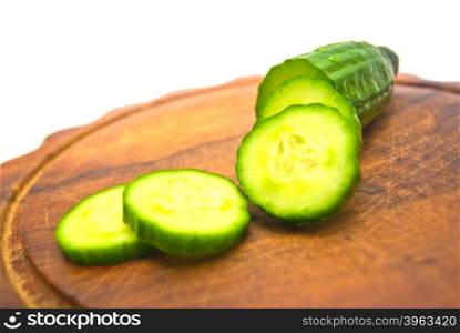 cucumber on cutting board on white background