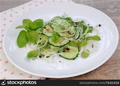 Cucumber salad, leek with mint and spices