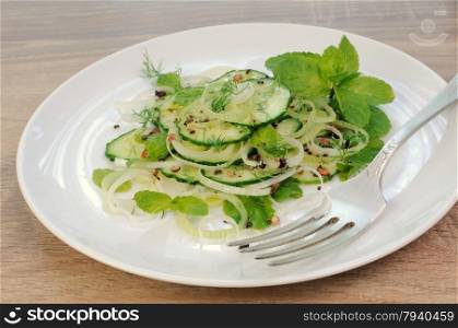Cucumber salad, leek with mint and spices