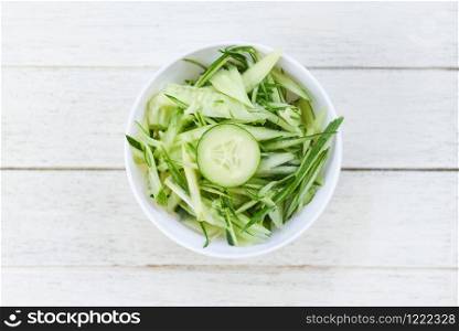 cucumber slice on white bowl , top view / shredded cucumber sliced for salad or cooking food