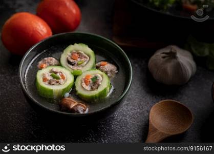 Cucumber soup stuffed with pork, with carrots, chopped green onions, shiitake mushrooms and garlic and.
