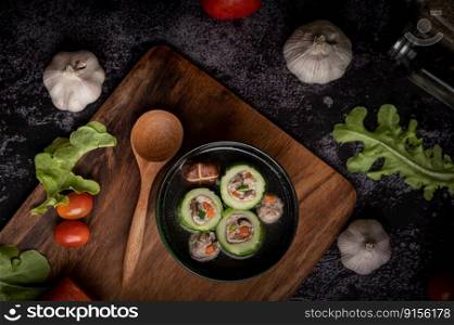 Cucumber soup stuffed with pork, with carrots, chopped green onions, shiitakeμshrooms and garlic and.