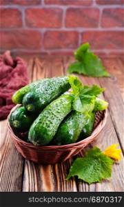 cucumbers in basket and on a table