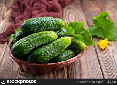 cucumbers in basket and on a table