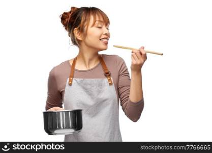 culinary and people concept - happy smiling female chef in jacket with saucepan cooking food over white background. happy smiling female chef with saucepan