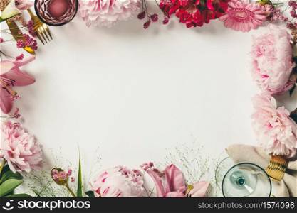 Cultery, glasses and flowers - Spring and festive table setting concept, border, frame, flat lay