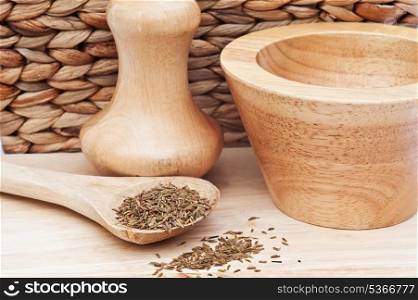 Cumin seeds in rustic kitchen scene with wooden utensils
