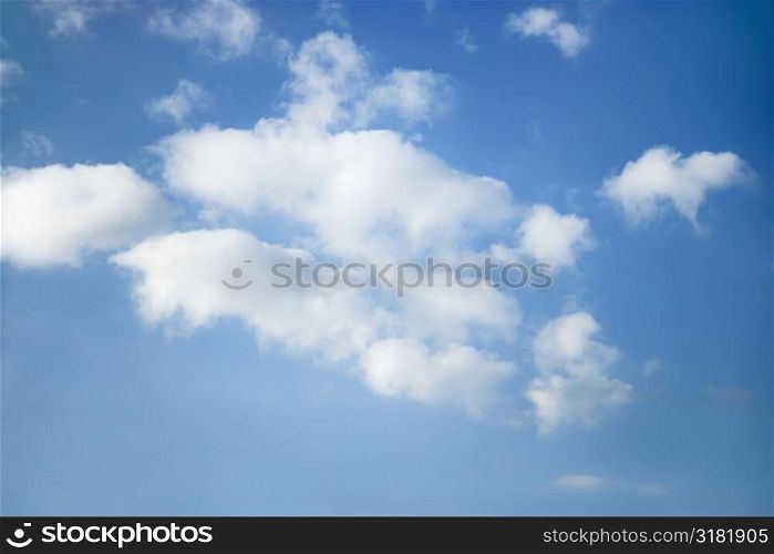 Cumulus clouds in blue sky.