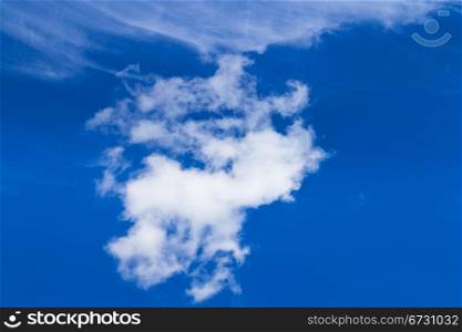 cumulus clouds in dark blue summer sky