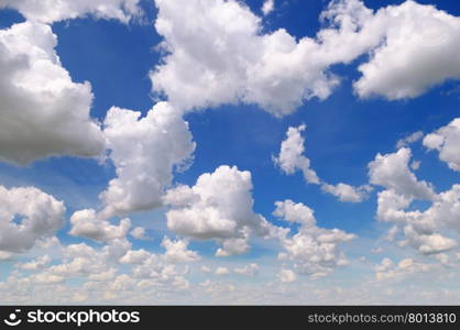 cumulus clouds in the blue sky