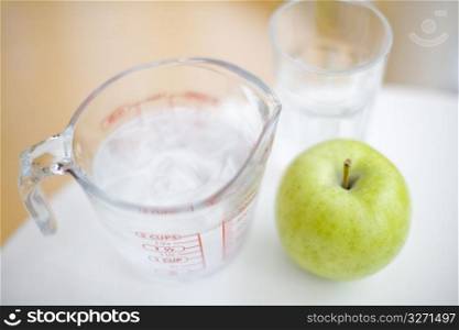 Cup and apple