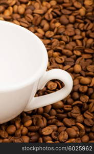 Cup and coffee beans isolated on the white