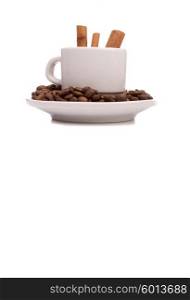 Cup and coffee beans, isolated over white background