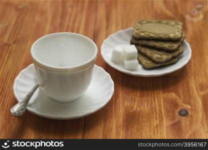 Cup and cookies. empty Cup and cookies on wooden background