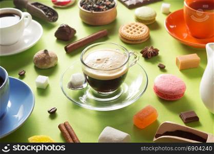 cup and ingredients at green paper background