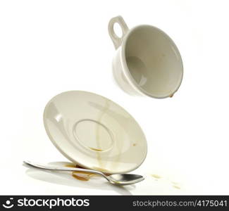 Cup and saucer with spilled coffee