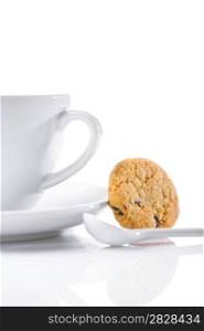 cup and spoon with cookie isolated