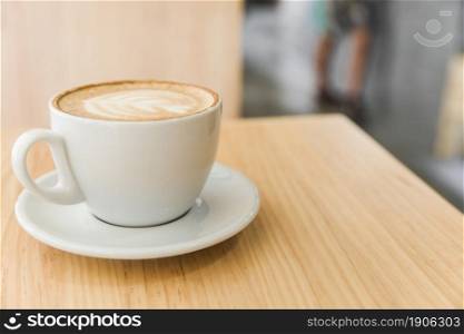 cup art latte cappuccino coffee wooden table. High resolution photo. cup art latte cappuccino coffee wooden table. High quality photo