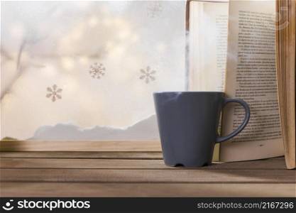 cup book wood table near bank snow snowflakes