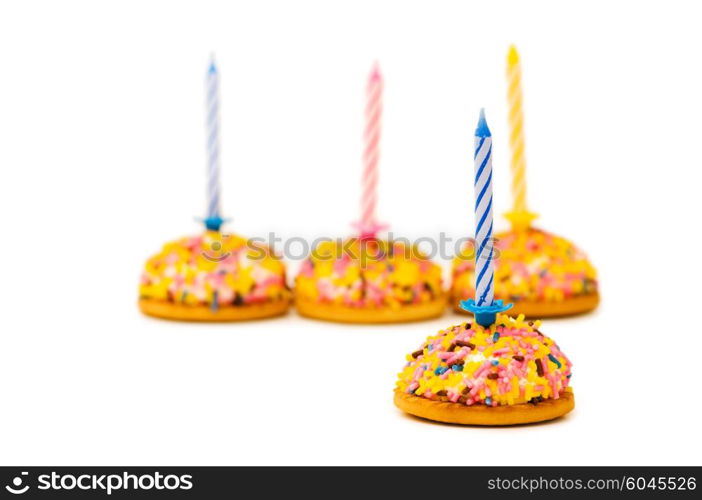 Cup cakes and candle isolated on the white background