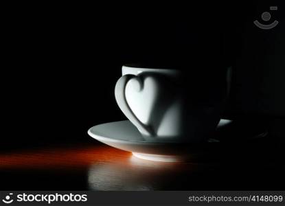 cup in dark with heart shape