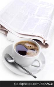 cup of black coffee and newspaper