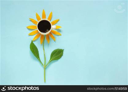 Cup of black coffee and yellow petals stalk flower shaped. Creative Flat lay Top view Copy space. Concept good morning.. Cup of black coffee and yellow petals stalk flower shaped. Creative Flat lay Top view Copy space. Concept good morning